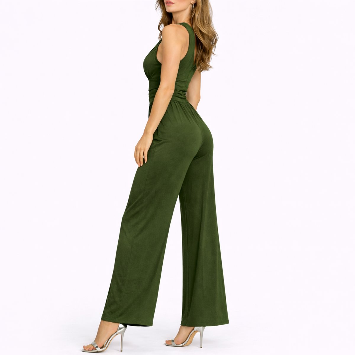 Green jumpsuit worn by a model on a white background